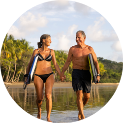 Couple holding hands on beach