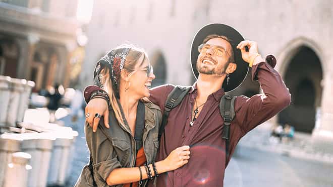 Couple laughing in a European city street