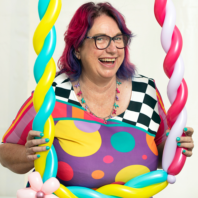 Flossie holding a balloon picture frame