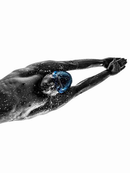 A male swimmer taking a plunge