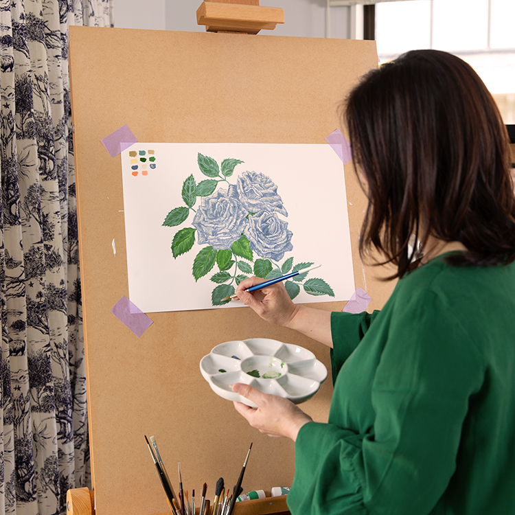  Maggie at work on a hand-painted design. Photo by Larnie Nicolson.