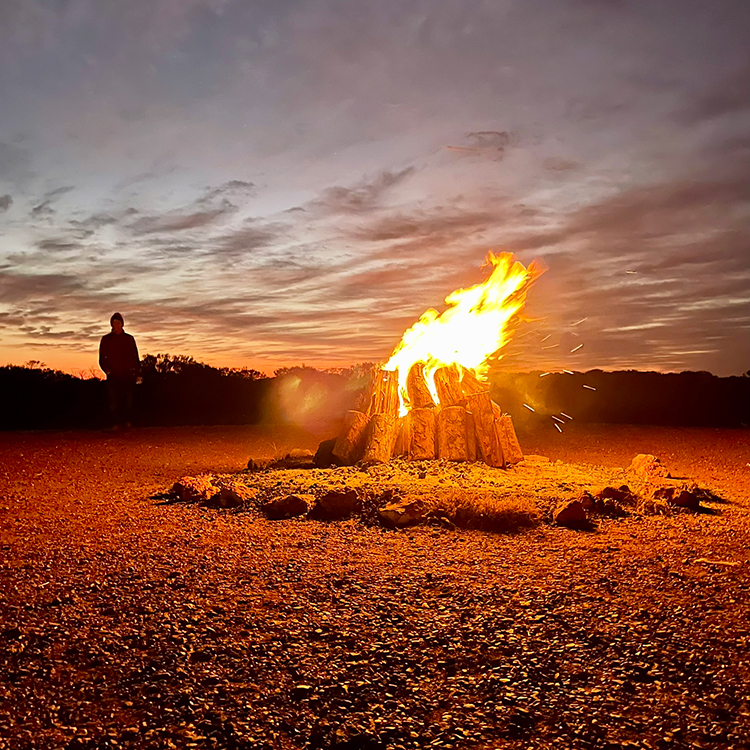 A sunrise bonfire at Marla. 