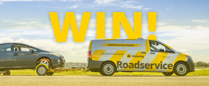 Win word written in yellow colour on top of AA Motoring Roadservice van