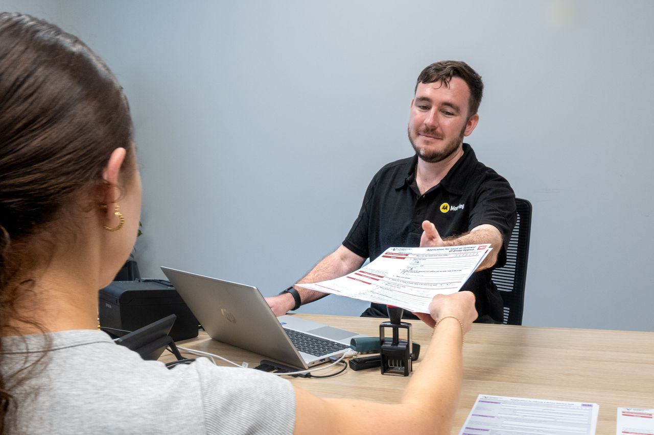 facilitator being handed a form