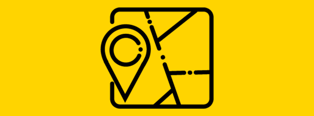 A simple black outline icon on a bright yellow background shows a map with intersecting roads and a location pin marker. The pin is placed on the map, indicating navigation, directions, or a specific location.