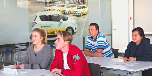 Four students in a defensive driving course lesson