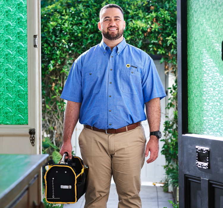 AA Home Response tradesperson smiling in a home's doorway