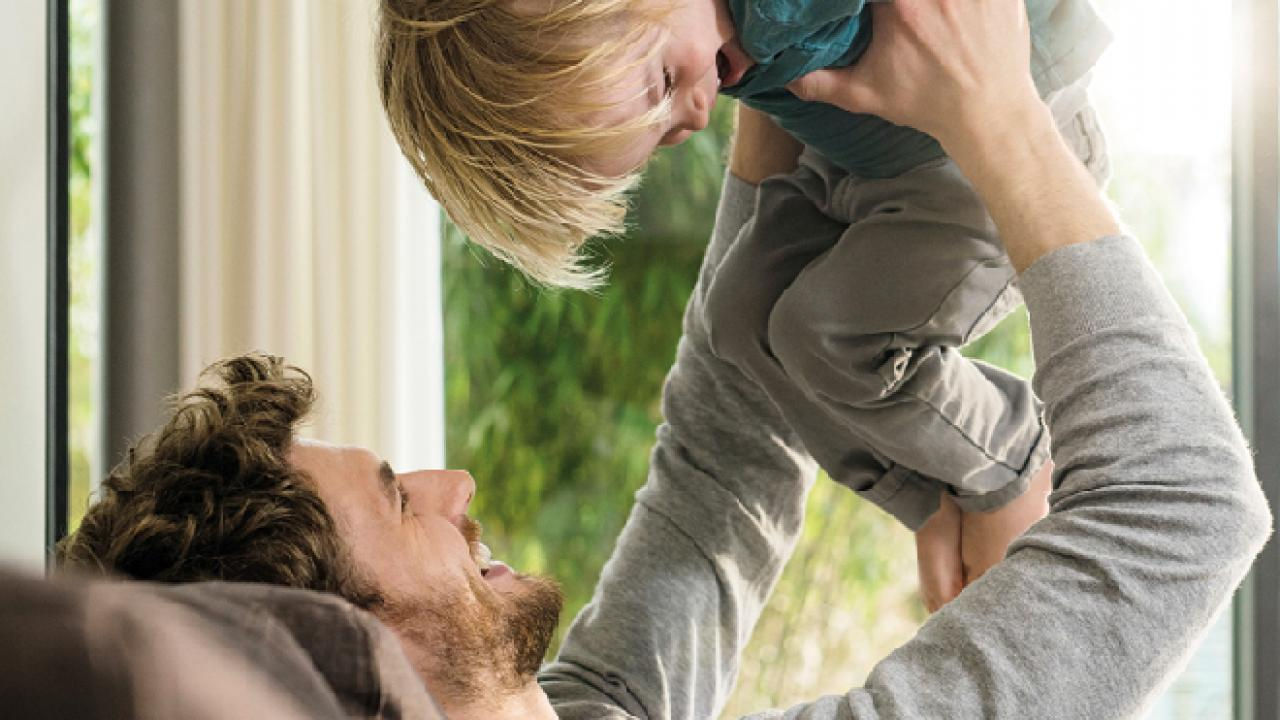 A man playing with his child