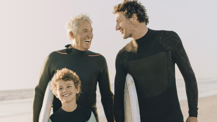 A grandfather, son, and grandson photo at the beach