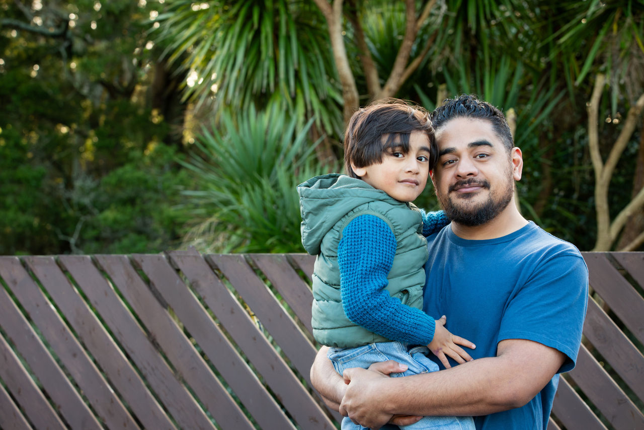 Man holding his young son