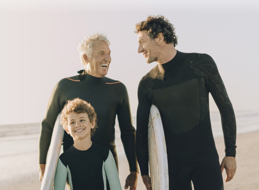 A grandfather, son, and grandson photo at the beach