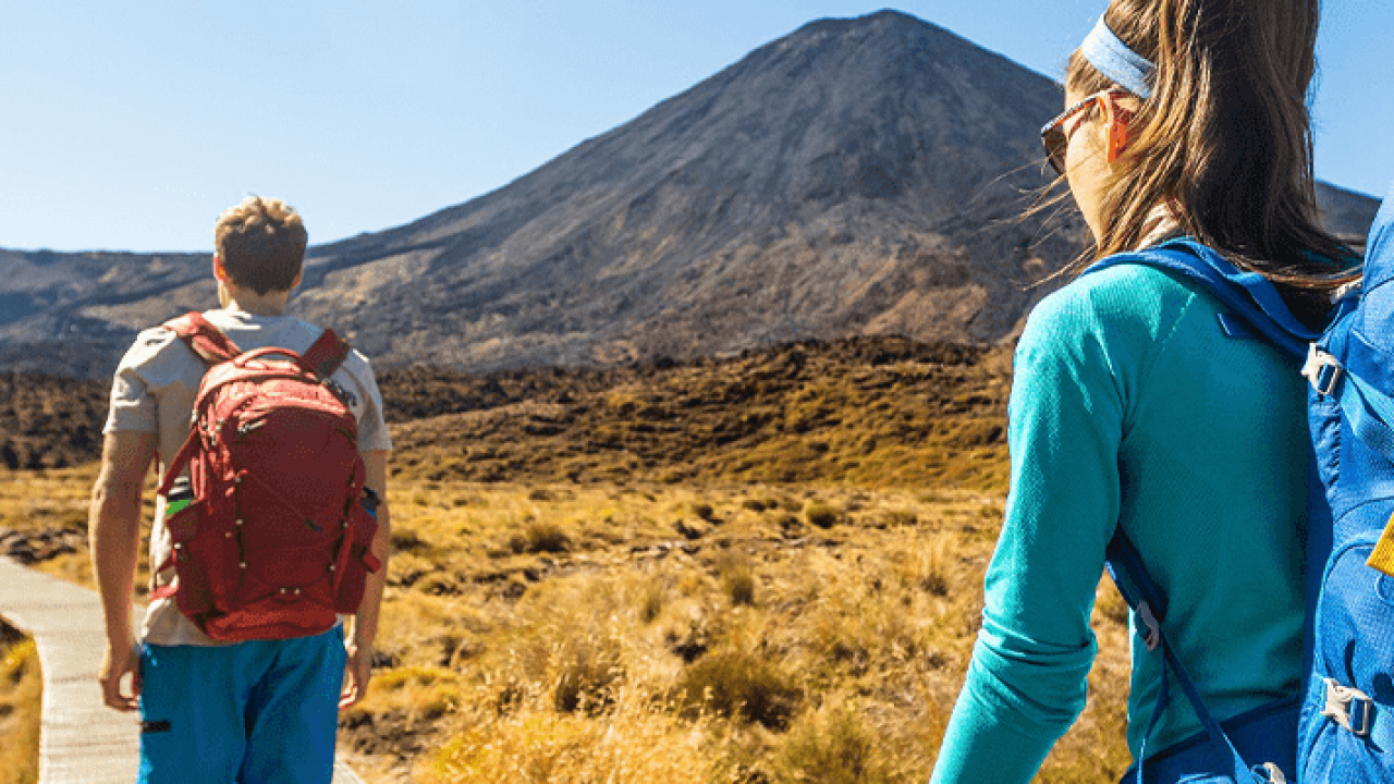 Hikers on a trail near Mount Ngauruhoe in New Zealand