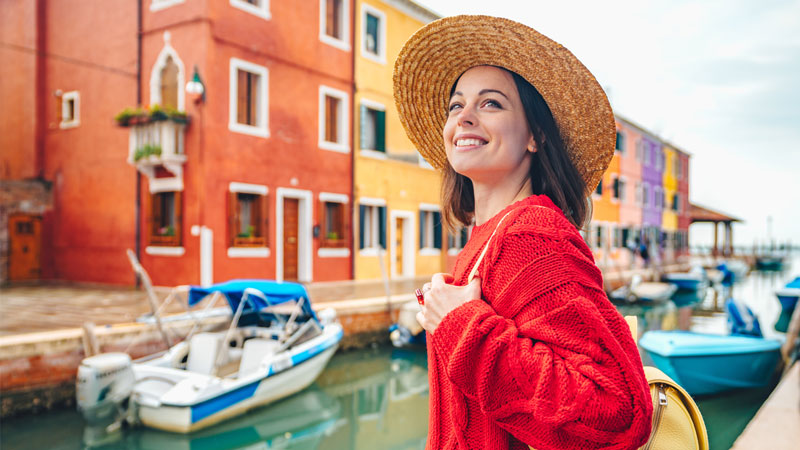 Young woman smiling in Venice canal