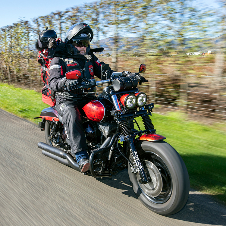 Stevin and Loki hit the road on the Harley-Davidson. Photo by Tim Cuff.