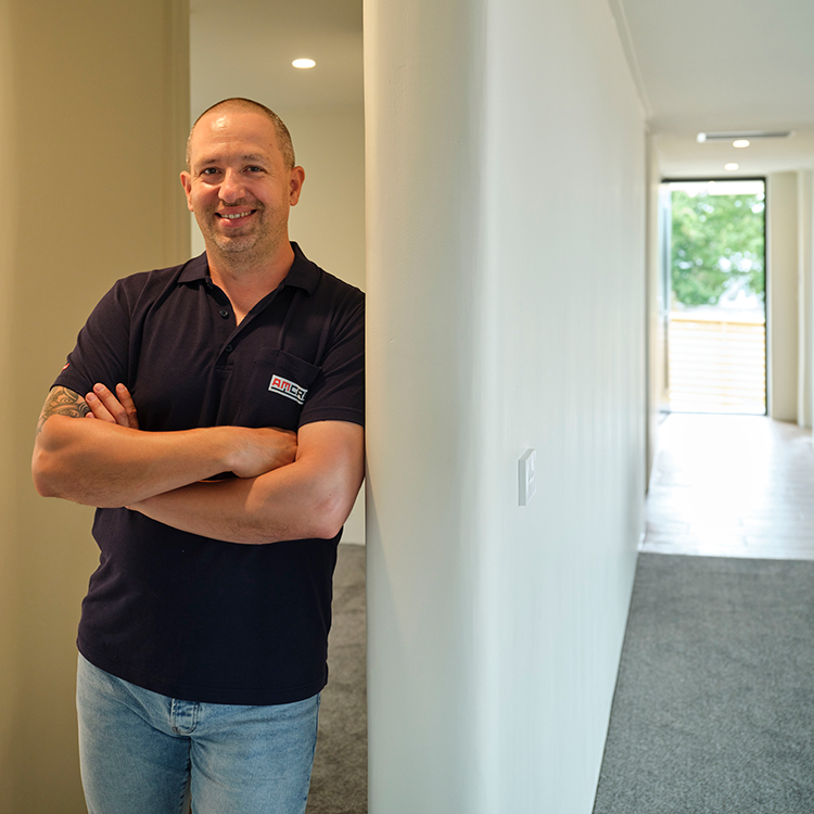 Kirril Ilin founder of Amcrete inside the 3D printed house in Waiuku. Photo by Mark Smith.