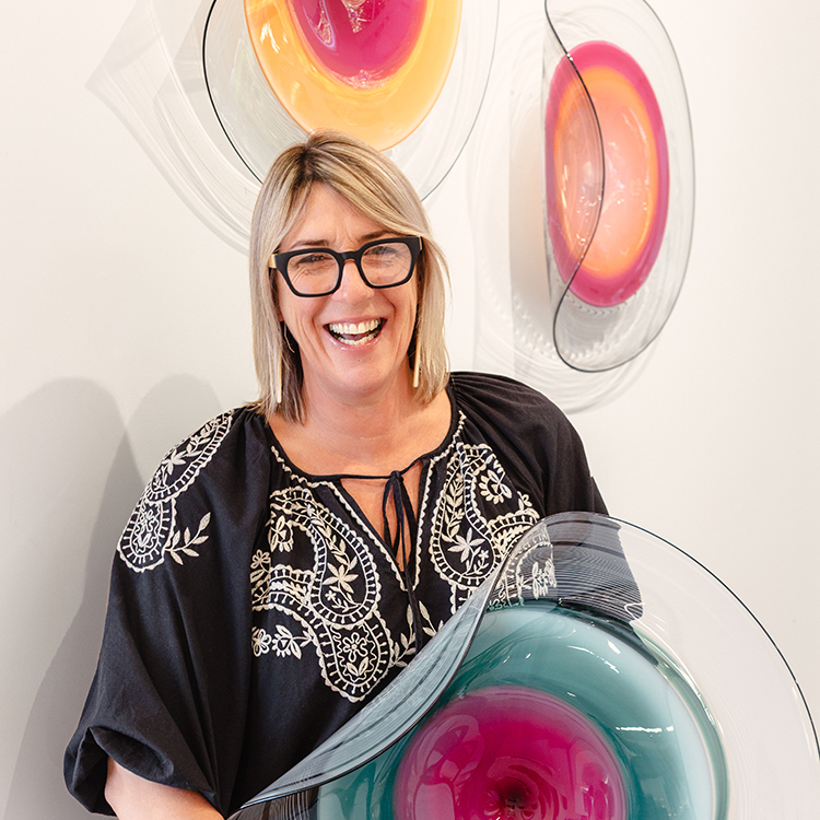 Katie Brown with one of her glass sculptures. Photo by Alanah Brown.