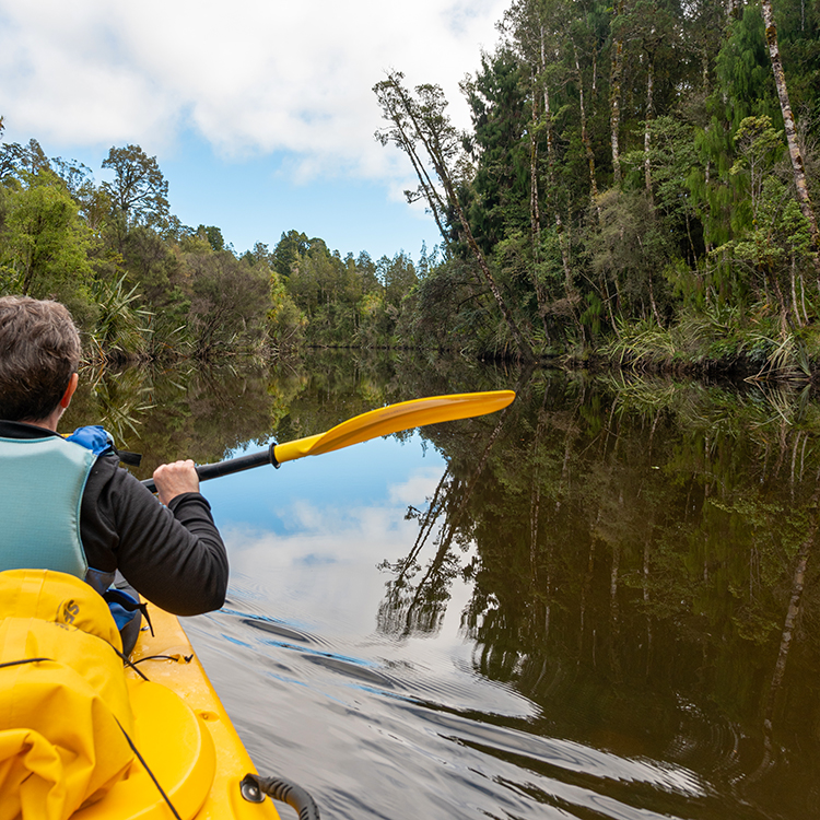 Exploring the famous Ōkārito lagoon by kayak. Photo by Mark Low.