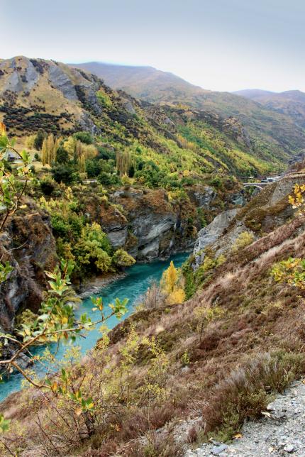 A view over the Kawarau River and historic bridge in Queenstown.