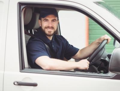 Guy in a car looking at the camera 