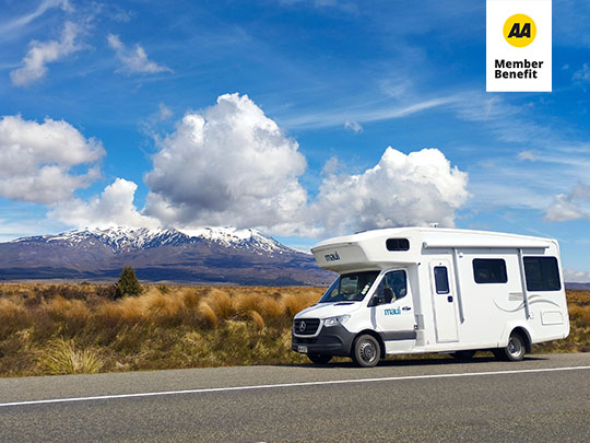 maui campervan parked on a rural road.